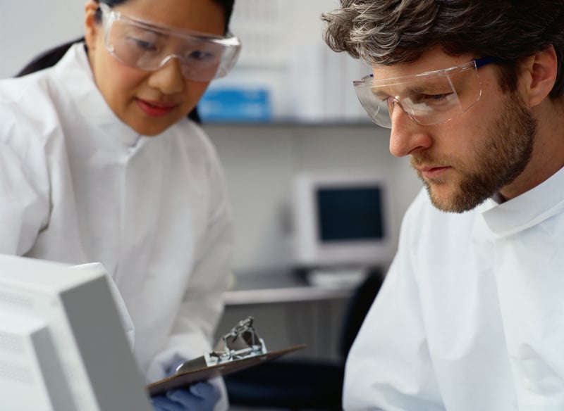 stock image of two scientists at a computer